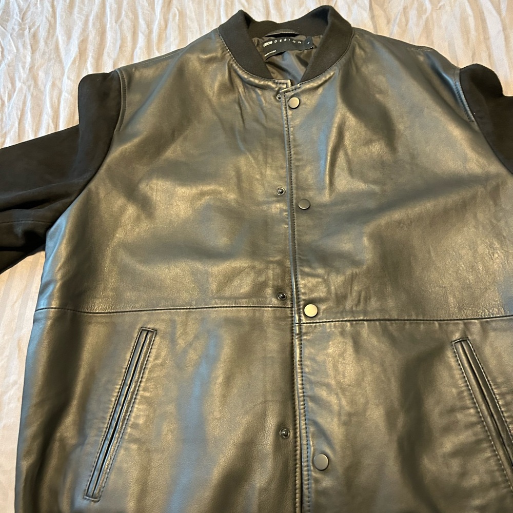 Osos leather jacket with material sleeves